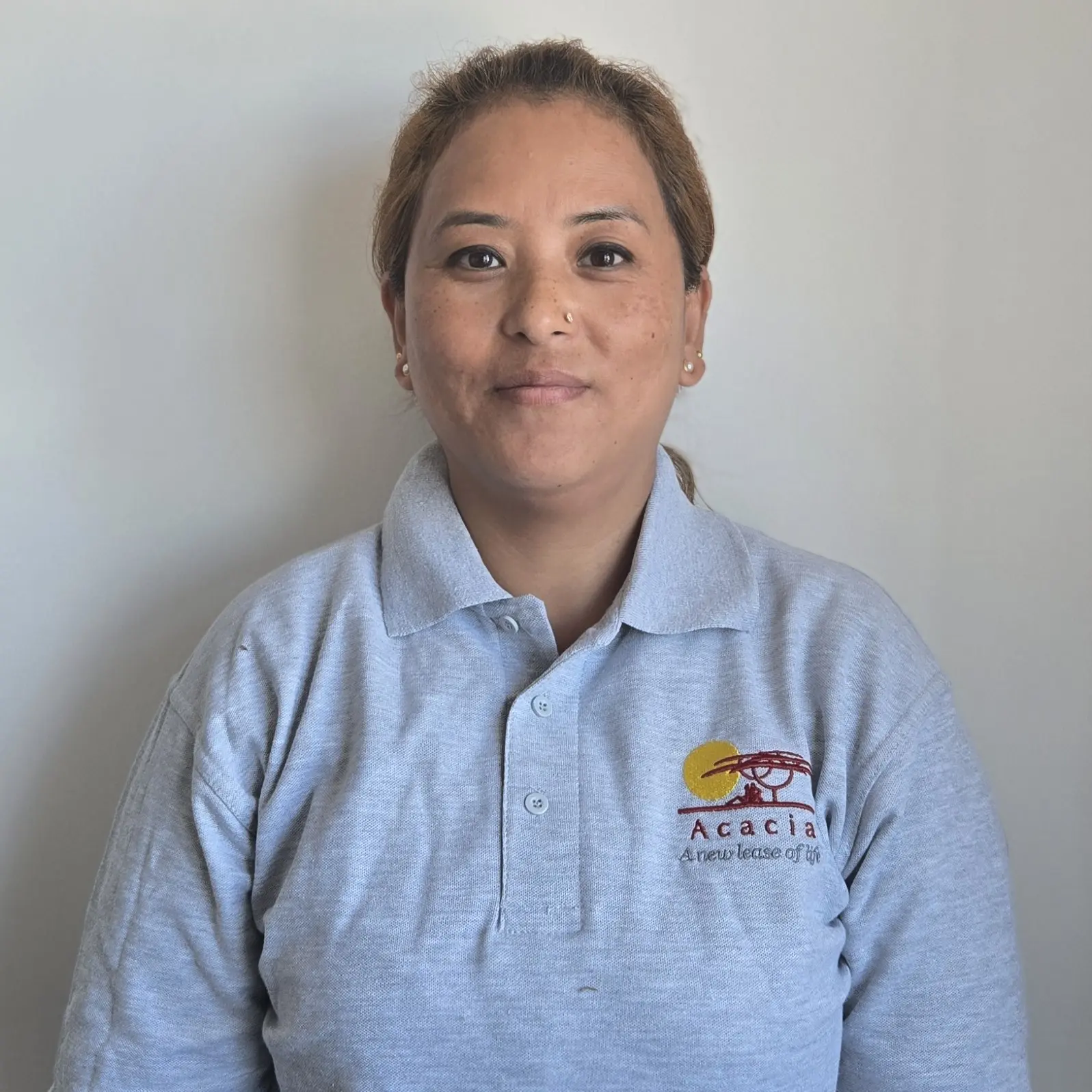 Ambika Lama in Acacia Homecare uniform.